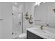 Clean bathroom with a walk-in shower, modern vanity, and tile floor at 210 Hammock Preserve Loop, Winter Garden, FL 34787