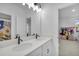 Double vanity bathroom with modern fixtures and a floral shower curtain at 210 Hammock Preserve Loop, Winter Garden, FL 34787