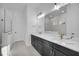 Modern bathroom with double vanity and walk-in shower at 210 Hammock Preserve Loop, Winter Garden, FL 34787