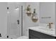 Clean bathroom with a walk-in shower, modern vanity, and tile floor at 210 Hammock Preserve Loop, Winter Garden, FL 34787