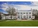 Two-story clubhouse with white exterior and metal roof at 210 Hammock Preserve Loop, Winter Garden, FL 34787