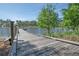 Wooden dock extending over calm lake water, surrounded by trees at 210 Hammock Preserve Loop, Winter Garden, FL 34787