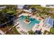 Aerial view of resort-style pool with lounge chairs and cabanas at 210 Hammock Preserve Loop, Winter Garden, FL 34787