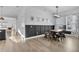 Dining room with a farmhouse table and dark wainscoting at 210 Hammock Preserve Loop, Winter Garden, FL 34787