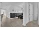 Light hallway with dark wainscoting and hardwood floors at 210 Hammock Preserve Loop, Winter Garden, FL 34787