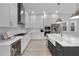 Modern kitchen with white cabinets, a large island, and stainless steel appliances at 210 Hammock Preserve Loop, Winter Garden, FL 34787