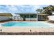 Backyard pool with an expansive deck and covered porch at 213 Oakland Ave, Sanford, FL 32773