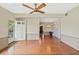 Open living area featuring hardwood floors, neutral paint, and natural light at 213 Oakland Ave, Sanford, FL 32773