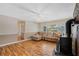 Cozy living room with fireplace, large windows, and hardwood floors at 213 Oakland Ave, Sanford, FL 32773