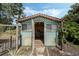 Lattice-clad tool shed with a double door, ideal for gardening or storing your outdoor equipment at 213 Oakland Ave, Sanford, FL 32773