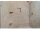 Tiled shower features built in shelves and a modern shower head at 213 Oakland Ave, Sanford, FL 32773