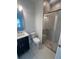 Modern bathroom with a large shower and dark vanity at 2229 Valentine Aly, Orlando, FL 32804