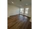 Bright bedroom with hardwood floors and large windows at 2229 Valentine Aly, Orlando, FL 32804