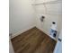 Convenient laundry room with wire shelving and hookups at 2229 Valentine Aly, Orlando, FL 32804