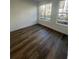 Spacious bedroom with wood-look floors and large windows at 2229 Valentine Aly, Orlando, FL 32804