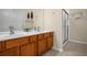 Double vanity bathroom with shower at 2549 Archfeld Blvd, Kissimmee, FL 34747