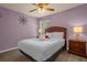 Bedroom with queen-size bed and nightstand at 2549 Archfeld Blvd, Kissimmee, FL 34747