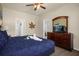 Bedroom with king-size bed and TV at 2549 Archfeld Blvd, Kissimmee, FL 34747