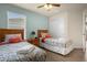 Bedroom with two twin beds and beach theme decor at 2549 Archfeld Blvd, Kissimmee, FL 34747