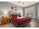 Spacious bedroom with a king-size bed and wood furniture at 2549 Archfeld Blvd, Kissimmee, FL 34747