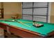 Game room with pool table and garage door view at 2549 Archfeld Blvd, Kissimmee, FL 34747