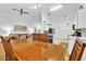 Bright dining room adjacent to kitchen, featuring a wooden table at 2610 Autumn Creek Cir, Kissimmee, FL 34747