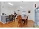 Kitchen and dining area with hardwood floors and wooden table at 2610 Autumn Creek Cir, Kissimmee, FL 34747