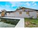 Back of house showing fire damage near the pool at 2667 Fitzhugh Rd, Winter Park, FL 32792