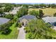 Aerial view of a two-story house with a gray roof and a large yard at 2764 Kingston Ridge Dr, Clermont, FL 34711