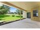 Covered patio overlooking a spacious grassy backyard at 2764 Kingston Ridge Dr, Clermont, FL 34711