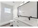 Bathroom with marble shower, double vanity, and modern fixtures at 2764 Kingston Ridge Dr, Clermont, FL 34711