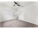 Bedroom with carpet, ceiling fan, and double doors to closet at 2764 Kingston Ridge Dr, Clermont, FL 34711