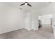 Bright bedroom with carpet flooring and access to other rooms at 2764 Kingston Ridge Dr, Clermont, FL 34711