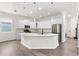 Modern kitchen featuring white cabinets and a large island at 2764 Kingston Ridge Dr, Clermont, FL 34711