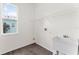 Laundry room with utility sink, shelving and vinyl flooring at 2764 Kingston Ridge Dr, Clermont, FL 34711