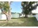 Fenced backyard with large trees and shed at 30 Old Barn Way, Casselberry, FL 32707