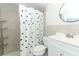 Clean bathroom with a white vanity and polka dot shower curtain at 30 Old Barn Way, Casselberry, FL 32707