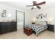 Bedroom with black dresser and checkered bedding at 30 Old Barn Way, Casselberry, FL 32707