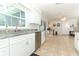 Well-equipped kitchen with white cabinets and granite countertops at 30 Old Barn Way, Casselberry, FL 32707