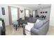 Cozy living room featuring a gray sectional sofa and wood coffee table at 30 Old Barn Way, Casselberry, FL 32707