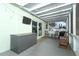 Relaxing screened porch with rocking chairs and string lights at 30 Old Barn Way, Casselberry, FL 32707