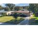 Single story home with landscaped yard and driveway at 3020 Nancy St, Orlando, FL 32806