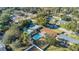 Aerial view of the house and backyard, featuring a large swimming pool at 3020 Nancy St, Orlando, FL 32806