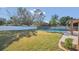 Large backyard with a swimming pool and grassy lawn at 3020 Nancy St, Orlando, FL 32806