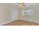 Bedroom with hardwood floors and white closet doors at 3020 Nancy St, Orlando, FL 32806