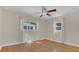 Well-lit bedroom featuring hardwood floors and ample natural light at 3020 Nancy St, Orlando, FL 32806