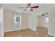 Spacious bedroom with hardwood floors and mirrored closet doors at 3020 Nancy St, Orlando, FL 32806