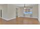 Hardwood floor dining room with chandelier and window at 3020 Nancy St, Orlando, FL 32806