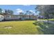 Tan house with green lawn and paved driveway at 3020 Nancy St, Orlando, FL 32806