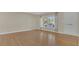 Bright living room with hardwood floors and large window at 3020 Nancy St, Orlando, FL 32806